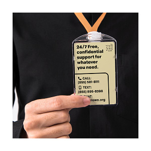 Person holding ID badge with YLI contact information 