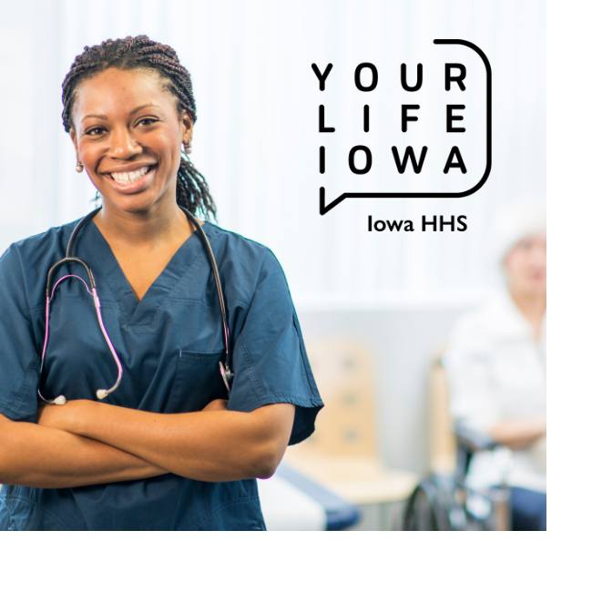 Woman wearing scrubs and a stethoscope standing and smiling 