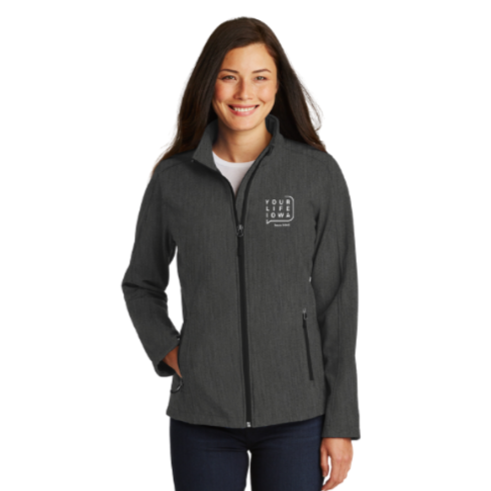 Woman modeling a gray zip-up jacket with the YLI logo.