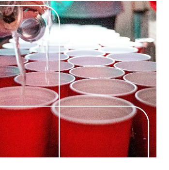 Group of red plastic cups on table, like at a party.