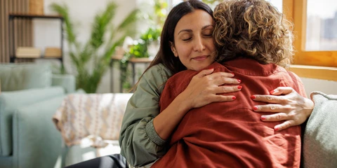 Women supporting each other and embracing