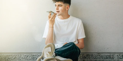 Teen boy talking on the phone