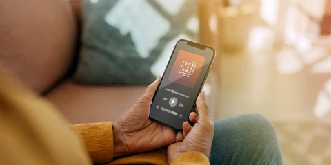 Person messaging Your Life Iowa on smartphone