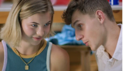two teens in quiet conversation