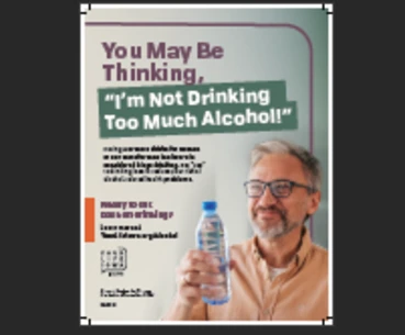 a man smiling and holding a water bottle