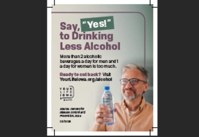 a man smiling and holding a water bottle