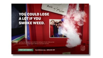 close-up of the inside of a red school locker with white text