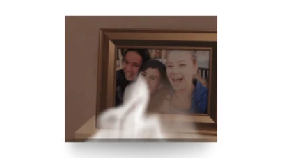 a framed family portrait with smoke in front of it