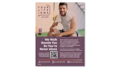a man seated and smiling at a gym, with text