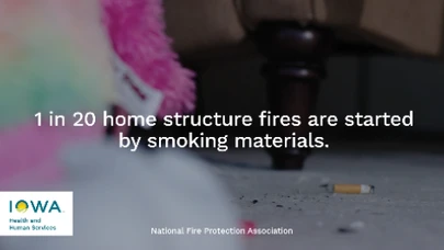 a cigarette butt on a living room floor with a child's stuffed animal in the foreground