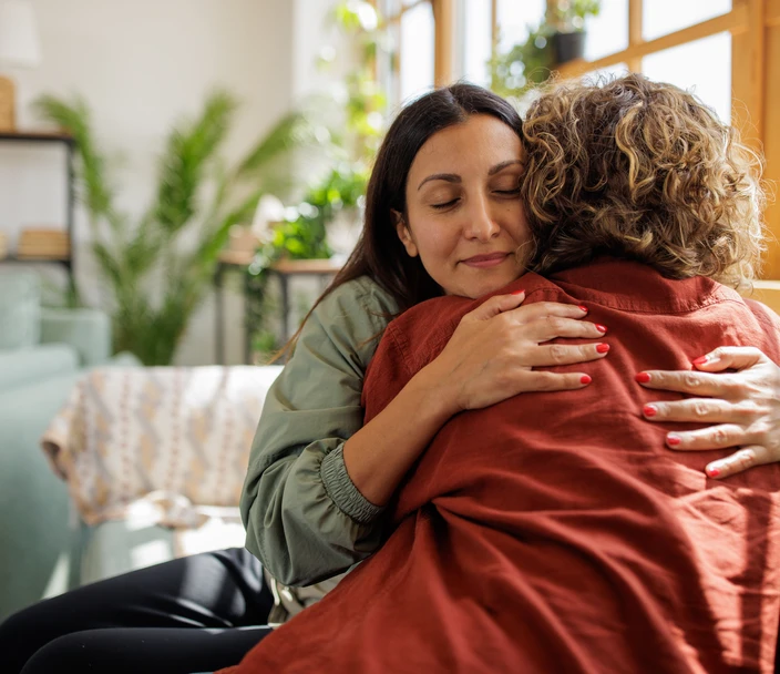 Women supporting each other and embracing