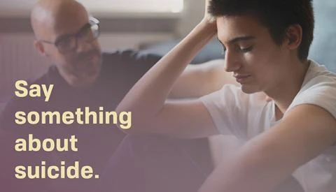 a parent and teen having a serious conversation while seated on the floor