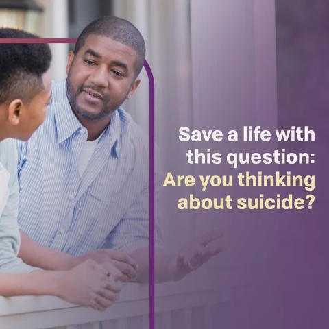 an adult talking seriously with a young adult