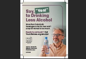 a man smiling and holding a water bottle