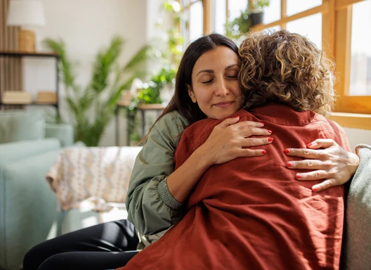 Women supporting each other and embracing