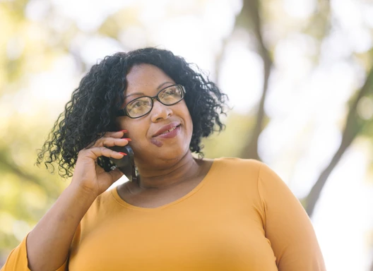 Woman talking on the phone outdoors