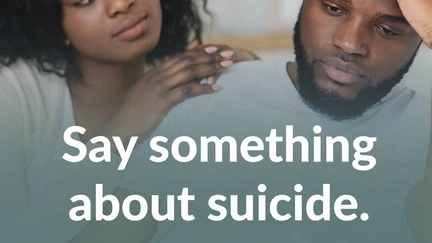 a person comforting another person who looks sad