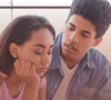 A man starts a conversation with a woman who looks concerned